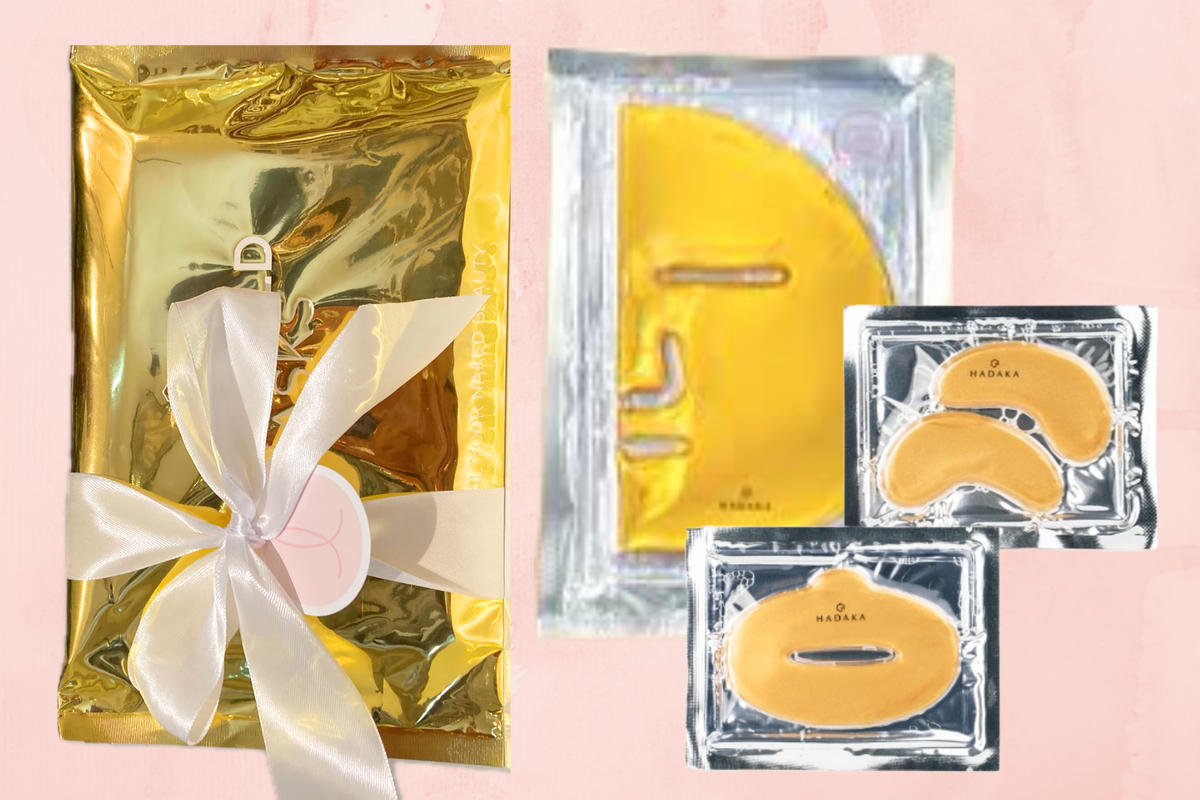 Trio Mask Set beside a gold gift package wrapped with a pink ribbon and bow.