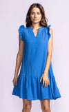 A model wearing the Bridget dress in blue, showing the ruffle sleeve and flowy drape, easily shipped to your door from Halifax to Vancouver.