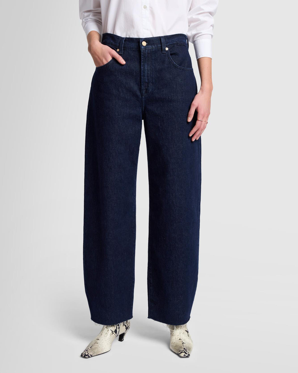 Front view of the Bonnie Barrel Leg Jeans by 7 For All Mankind, showcasing the full-length fit, dark rinse wash, and sculptural barrel-leg silhouette.