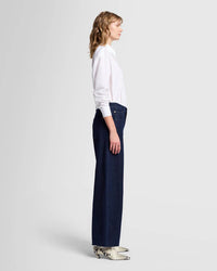 Side view of the Bonnie Barrel Leg Jeans by 7 For All Mankind, emphasizing the relaxed thigh fit and tapered ankle for a true barrel-leg effect.