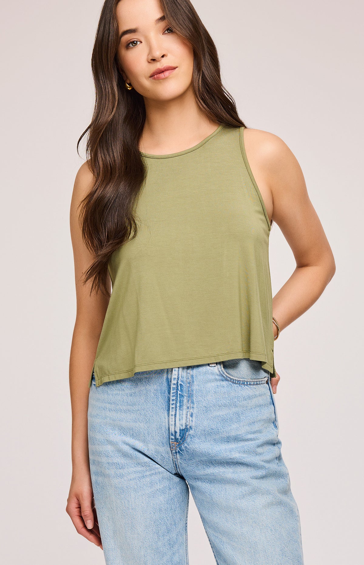 Model wearing the moss Diana Tank with jeans, a versatile eco-friendly tank top available at Lemonberry in Aurora, ON.