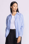 Front view of Dorit Top by Pink Martini in blue, unbuttoned, showcasing the striped pattern.