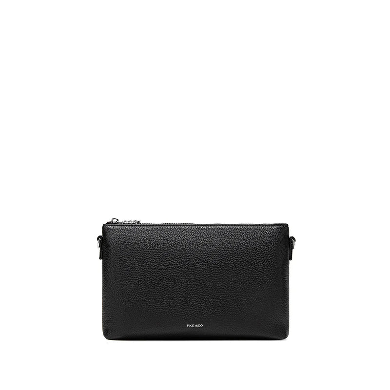 The large black Drea pouch, featuring a spacious interior and detachable straps, perfect for use as a clutch or crossbody bag.