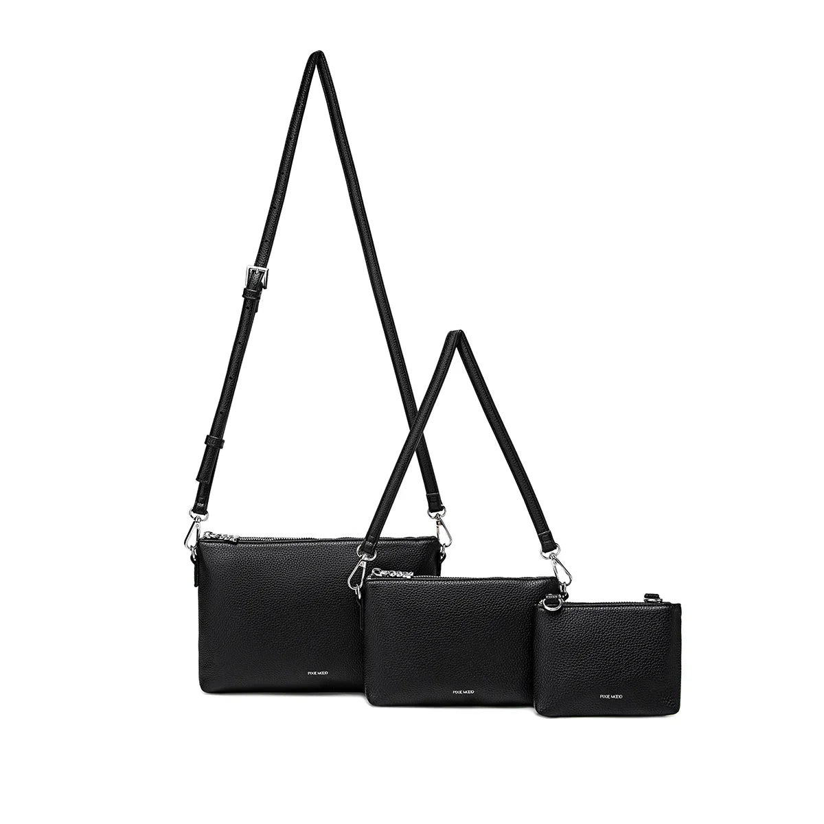 The Drea Pouches Set in black, featuring three different-sized pouches with two detachable straps, offering multiple ways to wear.