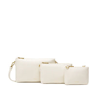 The Drea Pouches Set in white, neatly arranged with straps enclosed inside the pouches, showcasing their sleek and compact design.
