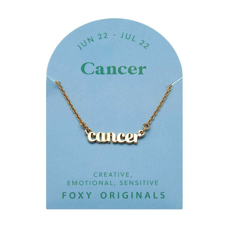 Foxy Originals Cancer Zodiac Necklace on its display card, featuring a gold script-style pendant with stylish packaging.