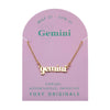 Foxy Originals Gemini Zodiac Necklace on its display card, featuring a gold script-style pendant with stylish packaging.