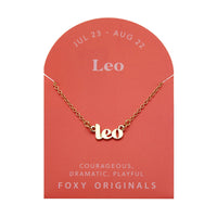 Foxy Originals Leo Zodiac Necklace on its display card, featuring a gold script-style pendant with stylish packaging.