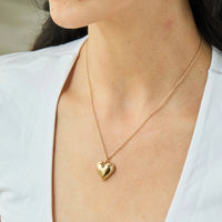 A model wearing the Foxy Originals Sweetheart Necklace in gold, featuring the heart pendant on a delicate chain.