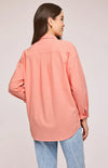 Back view of the Callahan Shirt in Bellini color, showcasing the side slits and overall relaxed style.