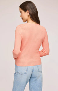 Back view of the Mia Top in Bellini color, highlighting the slim fit and button closure details.