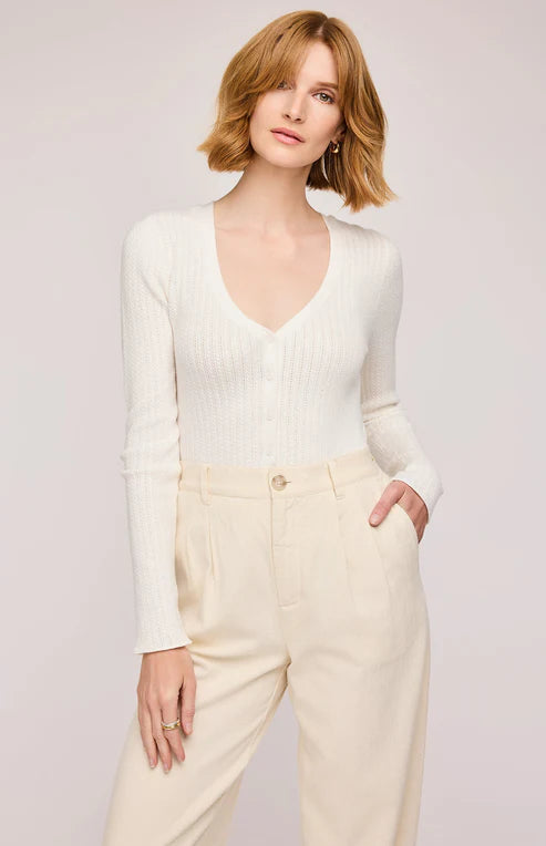 Front view of the Mia Top in White, featuring the V-neckline, button front, and chic knit details.