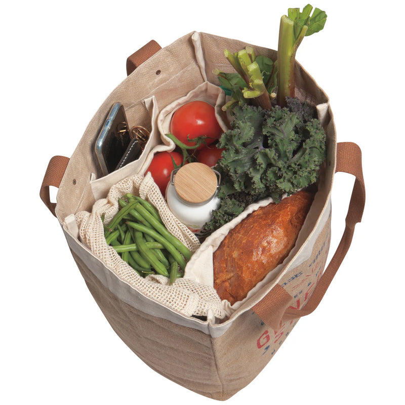 Bird's eye view of the Goods & Provisions Market Tote by Now Designs, filled with groceries, demonstrating its ample storage space.