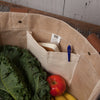 Close-up of the inside features of the Goods & Provisions Market Tote by Now Designs, showcasing its spacious interior for groceries.