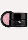 Close-up of Henne's Rose Diamonds Lip Exfoliator, showcasing its blush petal pink crystals and delicate rose scent.