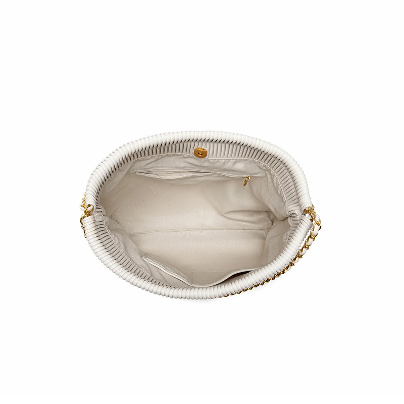 Inside view of the white Isabella Shoulder Bag with personal items inside, demonstrating the white bag's functionality and spacious design.