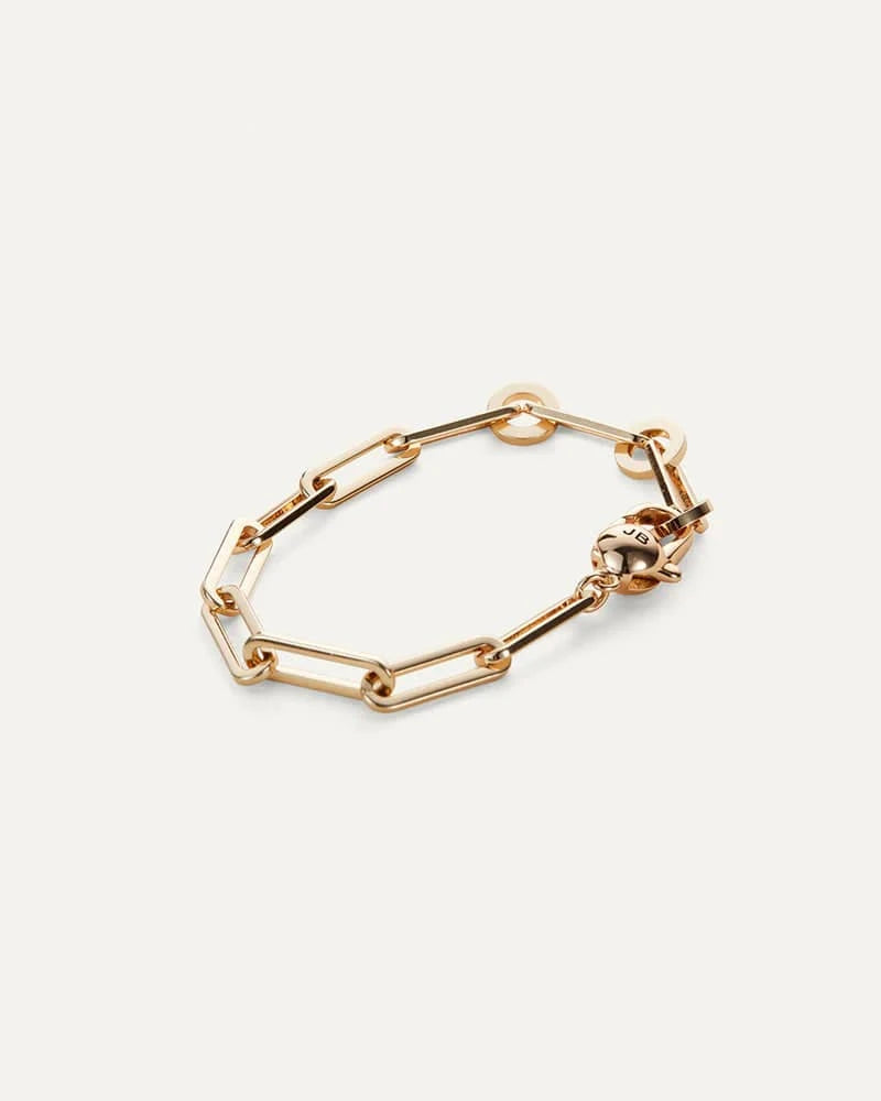 The Andi Slim Bracelet by Jenny Bird, displayed on a white background, highlighting the sleek paperclip design and high-polish gold finish.