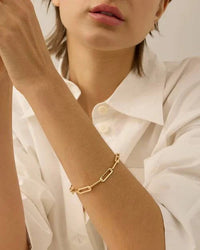 The Andi Slim Bracelet by Jenny Bird worn on the wrist, showcasing the elegant, adjustable fit and modern design.