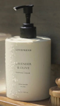 Lovefresh Everyday Cream in Lavender & Olive, a 500ml pump bottle of deeply hydrating body lotion with soothing lavender and nourishing olive oil.