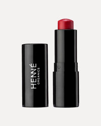 Henné Luxury Lip Tint in Desire, a rich red hue for a bold and seductive finish