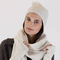 Model wearing a white Lyla & Luxe Beanie, showcasing a cozy and snug fit for winter.