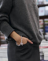 Model wearing the Jenny Bird Padlock Heart Chain Bracelet in silver, showcasing its elegant and modern design.