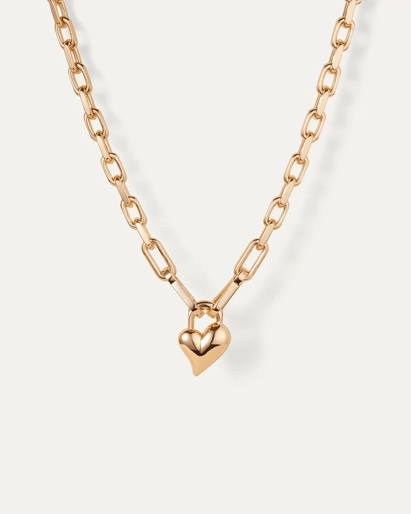 Padlock Heart Pendant Necklace by Jenny Bird in gold on a white background, featuring a heart-shaped pendant and padlock design.