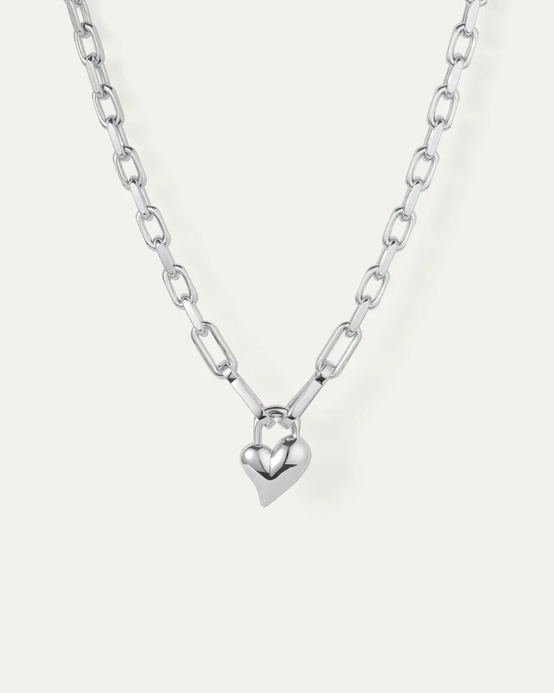 Padlock Heart Pendant Necklace by Jenny Bird in silver on a white background, featuring a heart-shaped pendant and padlock design.

