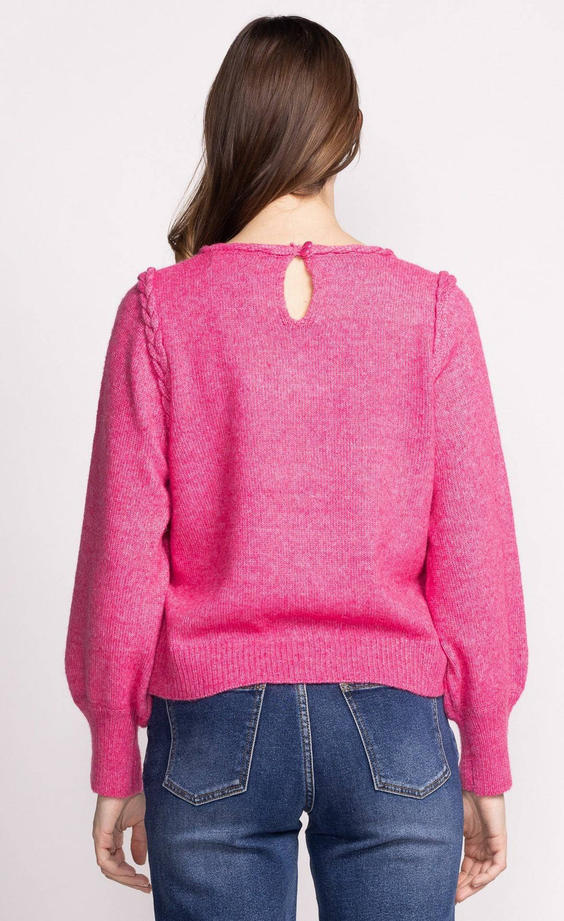 Back view of the Pink Martini Audrey Sweater highlighting its clean design and slightly billowed sleeves for a feminine touch.