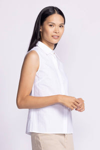 White side view of the Pink Martini Lisa Sleeveless Top, highlighting its modern cut and versatile, flattering fit.