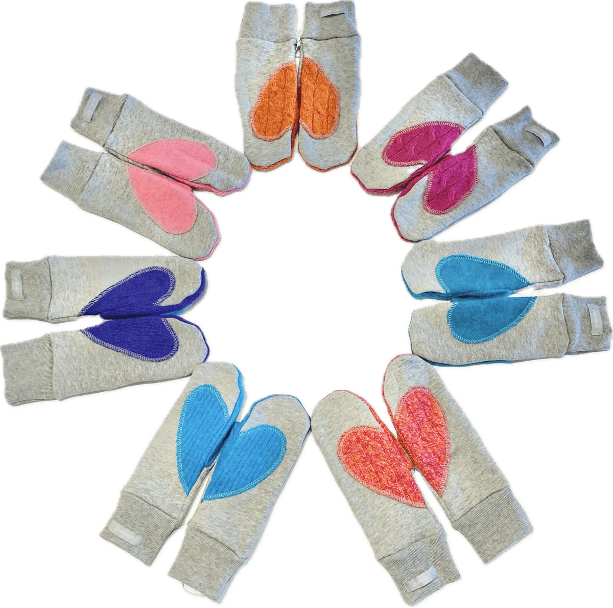 A collection of Preloved Ariel Mitts in various colours, each featuring a heart design, made from sustainable and upcycled materials in Canada.