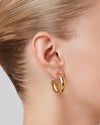 Staple Hoops Medium Earrings in gold worn on ear by Jenny Bird