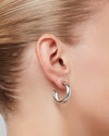 Staple Hoops Medium Earrings in silver worn on ear by Jenny Bird