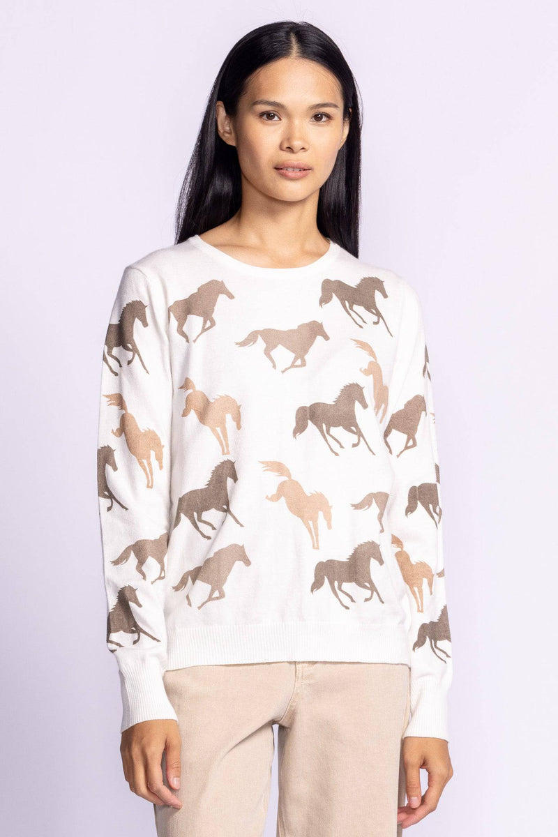 Model wearing the Wild Horses Sweater featuring a stylish horse print, perfect for equestrian fashion enthusiasts.