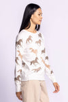 Model wearing the Wild Horses Sweater from a side angle, highlighting its unique equestrian-inspired design.