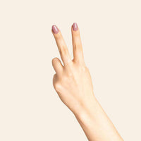 Hand with nails painted in Bkind Nail Polish, showcasing a fresh and vibrant color on fingers.