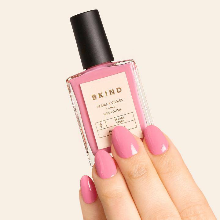 Bkind Nail Polish in a soft pink bottle, delivering a beautiful and vibrant color.