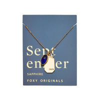 Foxy Originals Sapphire Birthstone Necklace displayed on a branded card, featuring a sapphire-toned stone representing truth, with a gold-plated finish.